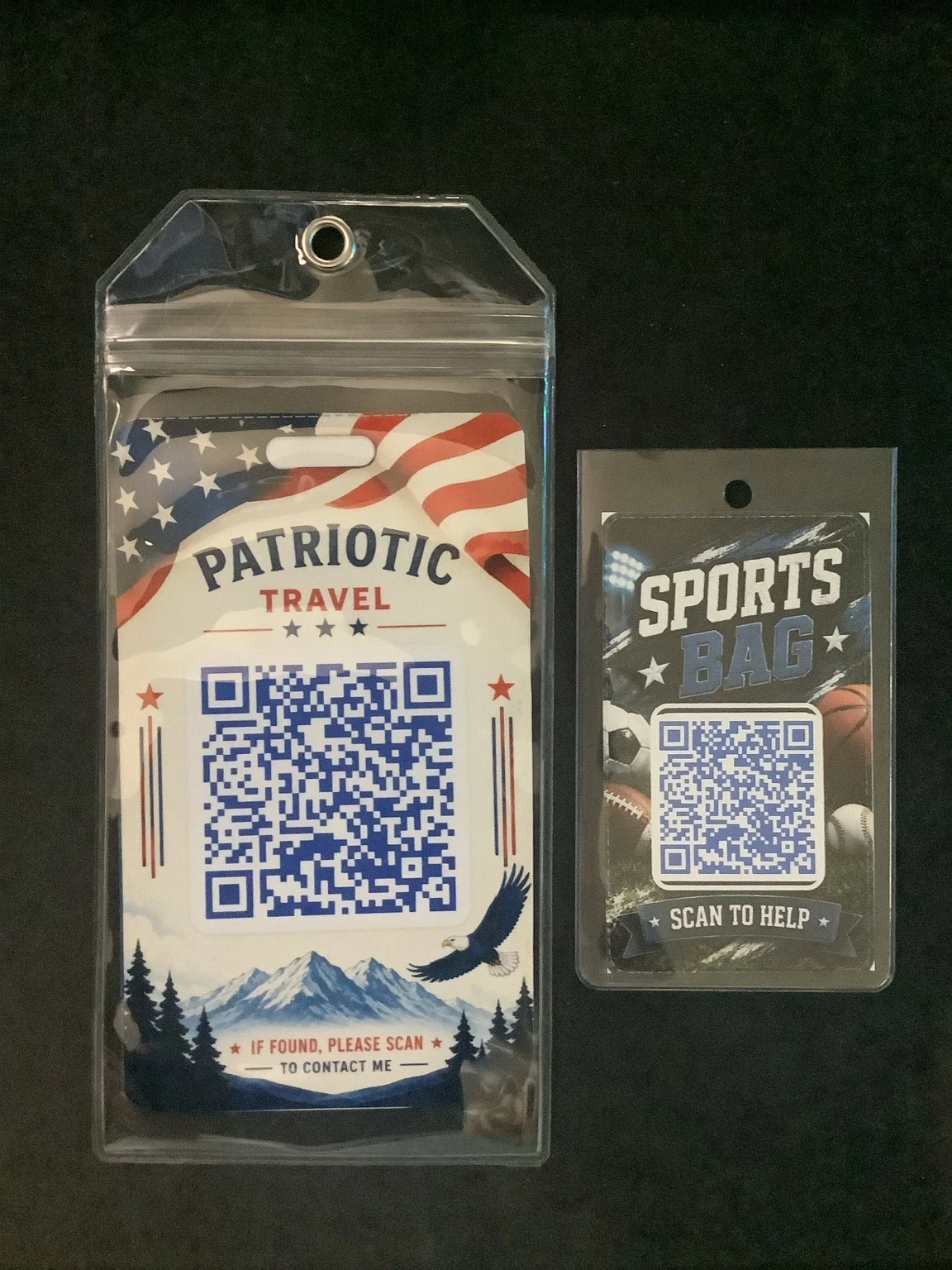 Real printed QR luggage tags in clear holders showing one standard patriotic travel tag and one smaller sports bag tag.