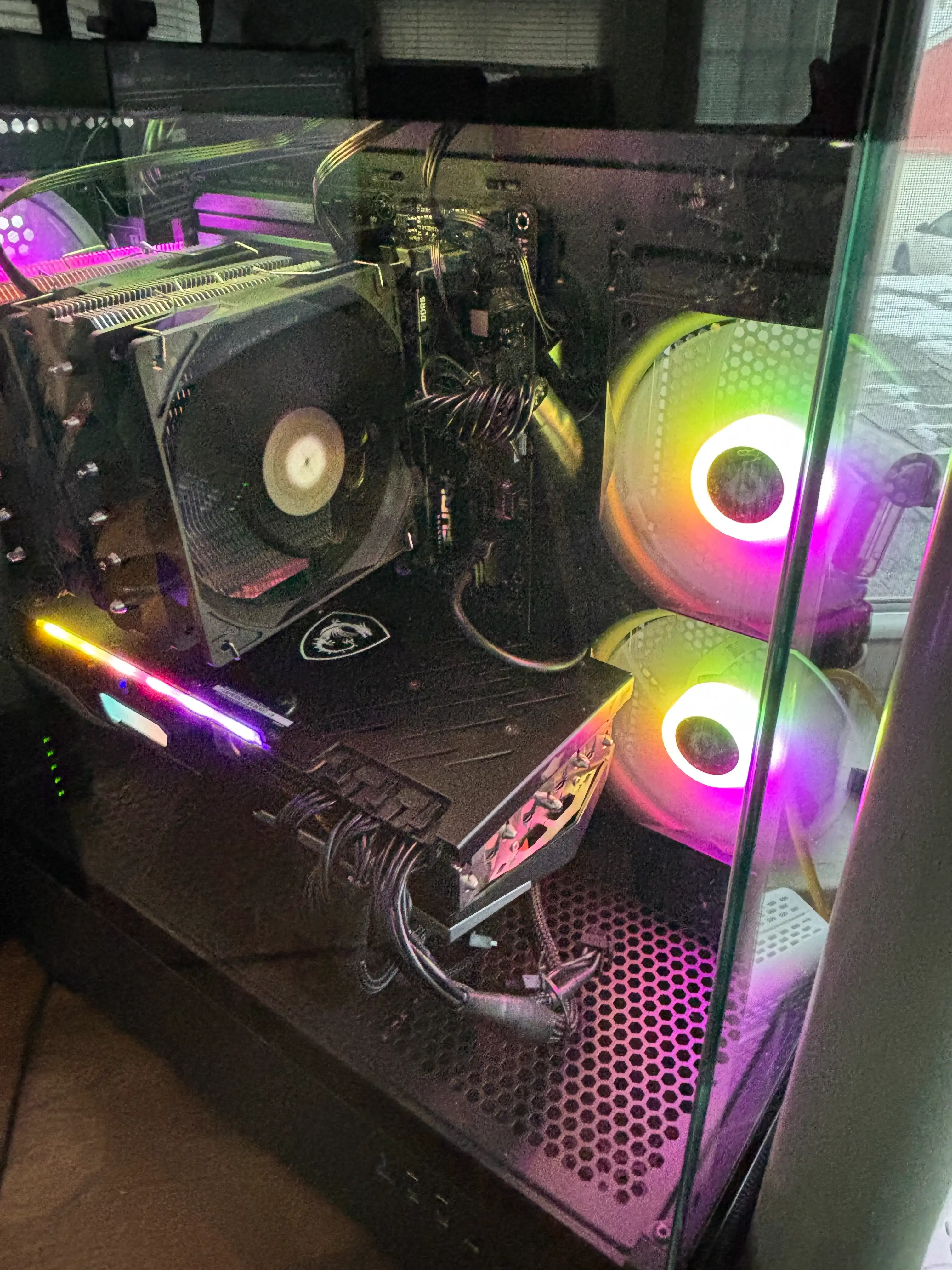 Side angle of the custom PC showing RGB fans and air cooler